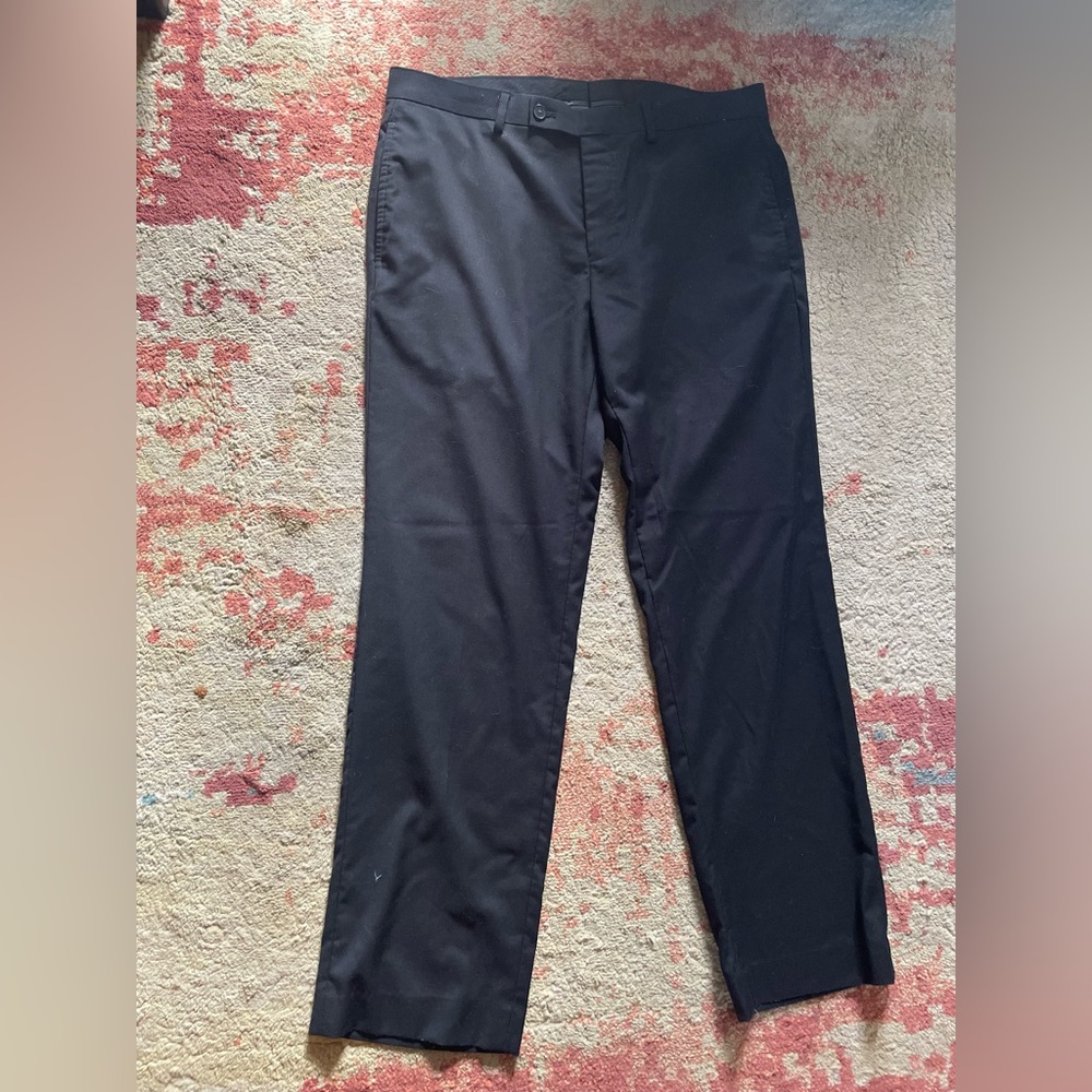 Men’s Calvin Klein black dress pants.  34W x 30L.  Lightly used. Good condition.